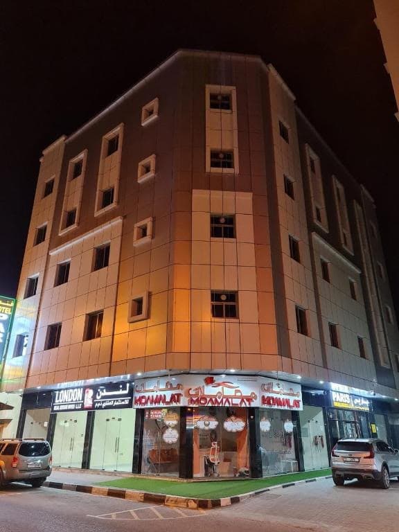 PARIS Furnished Apartments LLC illuminated exterior in Ajman